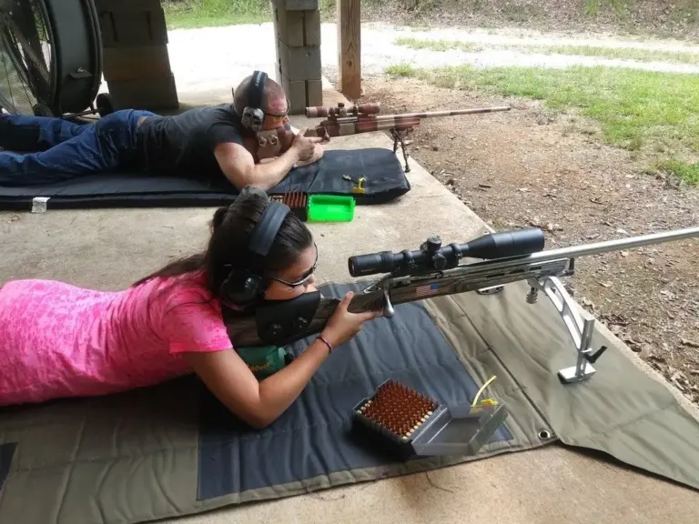 Two shooters prone on the covered rifle line